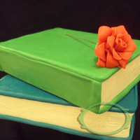 Stacked Books Cake Stacked books with a small gumpaste rose