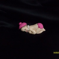 Another Baby wanted to try another baby with some "embelishments" this time i took her out of the mold too soon so her face got a little...