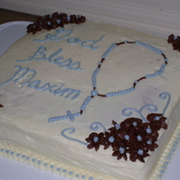 Baptism Cake White cake, lemon filling, BC icing and decorations. For my son's baptism.