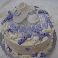 Baby Bootie Cake Italian buttercream, butter pecan cake, fondant booties and curls