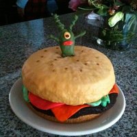 My First Cake - "krabby Patty" So here is my first attempt into the cake decorating world. I was fairly pleased. Yellow cake covered in MMF for the "bun" and...
