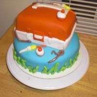 Fishing Cake mixture of wilton fondant and mmf covering and decorations.