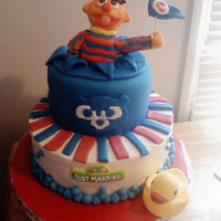 Cubs Fan Ernie Devil's food chocolate cake with cookies and cream filling and Indydebi's buttercream. Top layer is fondant covered. Ernie is...
