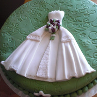 Sil's Shower Marble cake with chocolate buttercream icing. Fondant covering and flowers to match her 'Clover' and 'Sangria' David&#...