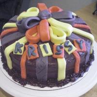 Birthday Cake Buttercream cake with fondant stripes and bow.