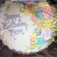 Flower Cake Chocolate cake with Bettercreme icing and flowers. Made for my mother-in-law. Sorry about the cellophane glare, but it's the only...