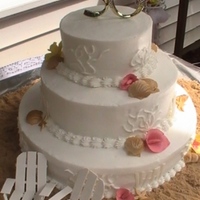 Beach Theme Anniversary This was for a 50th Anniversary. All buttercream, with gumpaste shells and chairs.