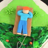 Fishing Dad Covered in Fondant and all elements are fondant.