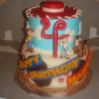 Jessie, Woody And Bullseye From Toy Story! 6" tier is choclate cake with peanut butter mousse. 8" is strawberry cake with vanilla filling and fresh strawberries.