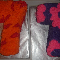 Cake For Twins red and orange cake is chocolate with vanilla frosting and purple/pink cake is strawberry cake with vanilla frosting.