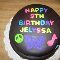 Neon Rainbow Birthday Cake This cake was a WASC rainbow cake filled with whipped strawberr ganache and covered in fondany with fondant accents.