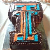 Texas Tech Wedding Cake A very non-traditional wedding cake. Chocolate WASC with a Reeses cheesecake filling with chocolate buttercream, chocolate MMF and orange/...