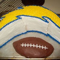 Charger Bolt A friend asked me to do this. It was my first carved cake. Star tipped. Football was just extra cake...looked funny, but oh well they ate...