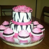 Pink Zebra Cake Top tier is strawberry, bottom tier is vanilla, and cupcakes are chocolate. TFL