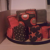 Black And Red Parcels this one is made up of small maderia squares individually wrapped in fondent then staked on top of each other, the corner designs are hand...