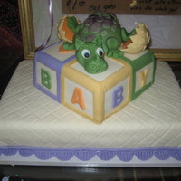 Baby Dragon Cake I got to make a cake for a good friend of mine, she wanted me to include a bay dragon and baby blocks. This is what she got, I loved...