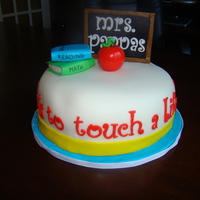 Teacher Appreciation Week Cake is White Almond Sour Cream with buttercream frosting and strawberries. Everything is then covered in fondant. Thanks for looking!