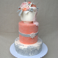 Coral Wedding Cake With Peacock Topper Three tier cake (technically four if you count the long on in the center). Center tier is covered with sanding sugar, bottom is decorated...