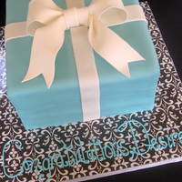 Tiffany Box Cake Vanilla butter cake with Nutella frosting. Second time doing a gift box cake...they are truly a challenge for the perfectionist...