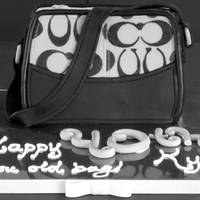 Coach Purse Cake Surprise cake for my [OLD] sister ;)Over the Hill cake (hence the gray and black theme) as a Coach purse...her fave ;)Fudge Brownie cake...