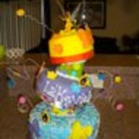 Fairies Cake This is a cake I created for my daughter's 8th Birthday. The bottom and top layer is yellow cake with buttercream icing. The middle...