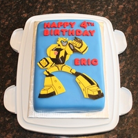 Transformers Bumblebee Birthday Cake Transformers Animated Bumblebee cake for my son's birthday. Bumblebee was cut out of yellow fondant using exacto knife through a...