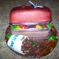 Fishing Tackle Box This was made for my Dad's 50th birthday. I used gummy worms, frogs and sweedish fish just for fun. The 'dirt' was ground...