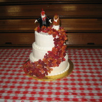 The Chicken Farmers Wedding Cake the groom is a chicken farmer so the bride hand sculpted the cake toppers out of modeling clay. A simple three tier round cake, marble with...