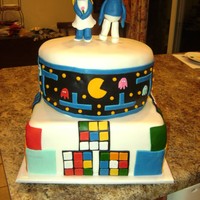 80's Cake Ultimate 80's cake, 2 tiers strawberry and orange dreamsicle covered in MMF. Smurf couple made from MMF.