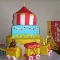 Dr. Suess Circus Cake My daughter's third birthday cake. Three layers with MMF decorations. The train cars were made from cereal treats and covered with...