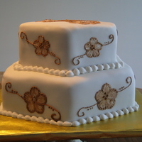 Brown And White Brush Embroidery Anniversary cake for a co-worker. Cake is white chocolate raspberry, with a semi-sweet whipped ganache filling with fresh raspberries....