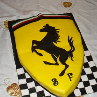 Ferrari Birthday Cake Chocolate cake with chocolate buttercream and raspberries. Made all from fondant.