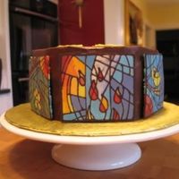 Stained Glass Cake Chocolate transfers to mimic the stained glass in our church. Hexagon shaped cake, each side with a different window, done to welcome our...