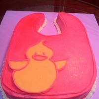 Baby Bib Baby bib with chocolate ducky. buttercream icing. Textured with patterned paper towel to give cloth look. Airbrushed Pink with White shells...