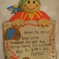 Pirate Cake For First Birthday this cake is a little less than a half a sheet cake with a half of a sports ball wilton cake for the head. all the decorations are fondant...