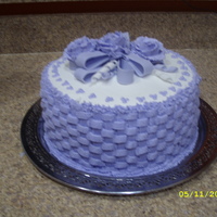 Made It For My Sis In Law B-Date A four layer cake. Chocolate/vanila/chocolate/vanilla. I need to improve on my bows. Other then that, I think i did pretty good.