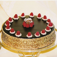 Chocolate And Ganache! Killer Chocolate cake filled with BC and covered with dark chocolate ganache (Callebaut Chocolate is the BEST!). The center chocolate piece...