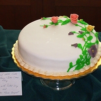 First Fondant Cake! This was the first cake I EVER made using rolled fondant. It is a white cake filled with alternating rings of CC frosting and pie cherries...