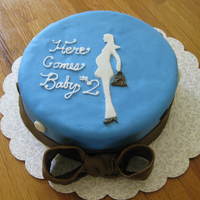 Baby Sprinkle Cake Vanilla cake with raspberry filling covered in white chocolate fondant!