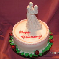 Anniversary Cake single layer anniversary cake with fondant icing. I aribrushed the edges. Cake is covered in fondant/