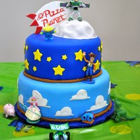 Toy Story 8 and 10 in cakes. Covered and decorated in marshmallow fondant. The moon rock is cake, iced and covered with marshmallow fondant.