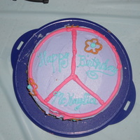 Hippie Cake This cake is made with a yellow cake mix colored to make it look tie dye and buttercream icing.