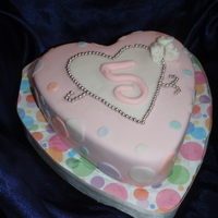 The Big Oh-Five! My daughter's 5th birthday cake. It's a choc chip cake with chocolate ganache. She put the cachous on herself, with the help of...