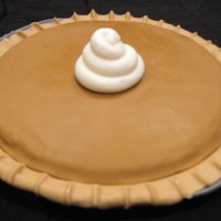 "pumpkin Pie" Cake Fondant pie crust and pie filling. Cake was fit into a pie pan.