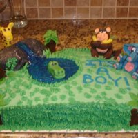 Jungle Cake I made this cake for a baby shower with a jungle theme. All the animals are made with plastic chocolate