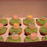 Spring Cupcakes! spring cupcakes! Yellow cupcakes filled with chocolate ganache, iced with buttercream and topped with a white chocolate candy clay rose