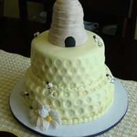 My Take On Martha Stewart's "beehive Cake" This was designed for a bee themed bridal shower. Handmade gumpaste and fondant beehive, bees and flowers.