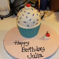 Giant Cupcake This was my first real cake.... I followed kileyscakes' instructions for the candy melt cupcake liner, and was inspired by many other...
