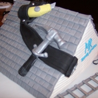 Birthday Cake For Roofer I made this cake for a gentlemen who owns his own roofing company. The "tiles" took a bit of time. The roof, tools, nails, belt...