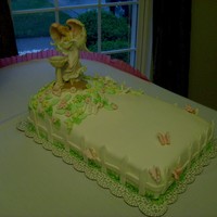 Baptist This cake is almond flavor, Boston cream filing. Cover with fondant, flowers and butterfly's are gum-paste.
